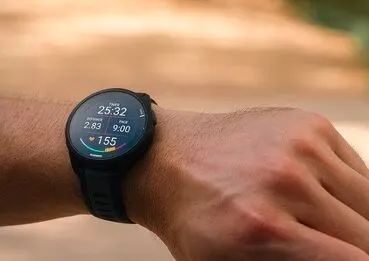 a man wearing Garmin Forerunner 165